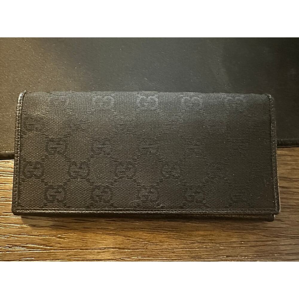 GUCCI GG BLACK CANVAS AND LEATHER BIFOLD WALLET